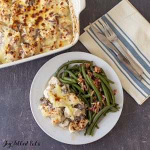 keto chicken marsala casserole on a plate with green beans
