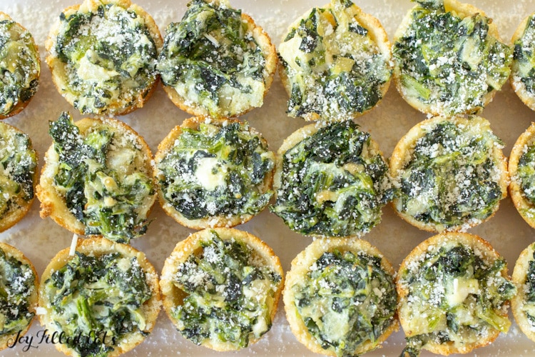 close up of a platter with spinach dip bites