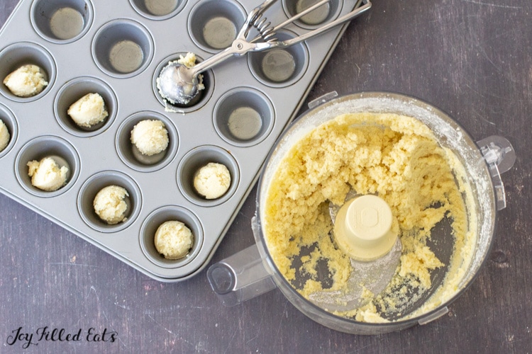 small scoops of dough in a mini muffin tin