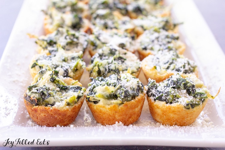 side view of a platter with keto spinach artichoke dip bites