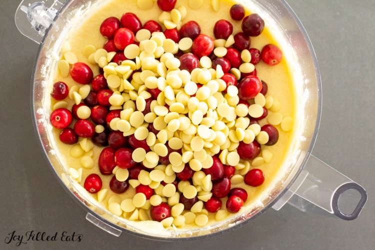 cranberries and white chocolate chips on top of the batter