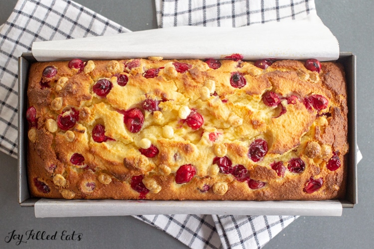 the baked white chocolate cranberry bread in a loaf pan