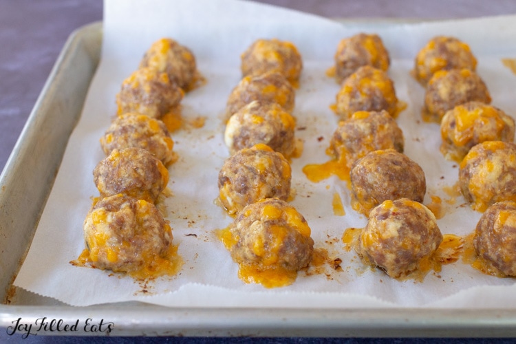 cooked sausage balls on a baking sheet