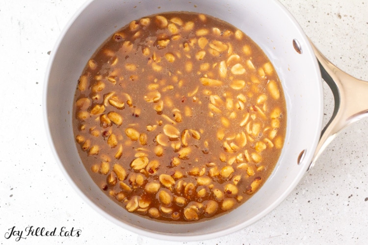 peanuts in caramel in saucepan