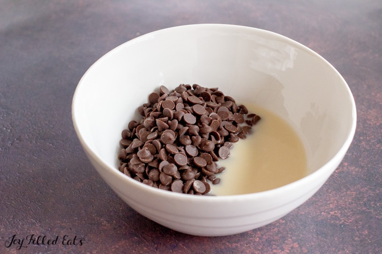 chocolate chips and coconut butter in a glass bowl