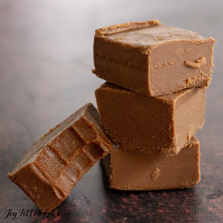 stack of 3 pieces of fudge, one on the side with bite missing