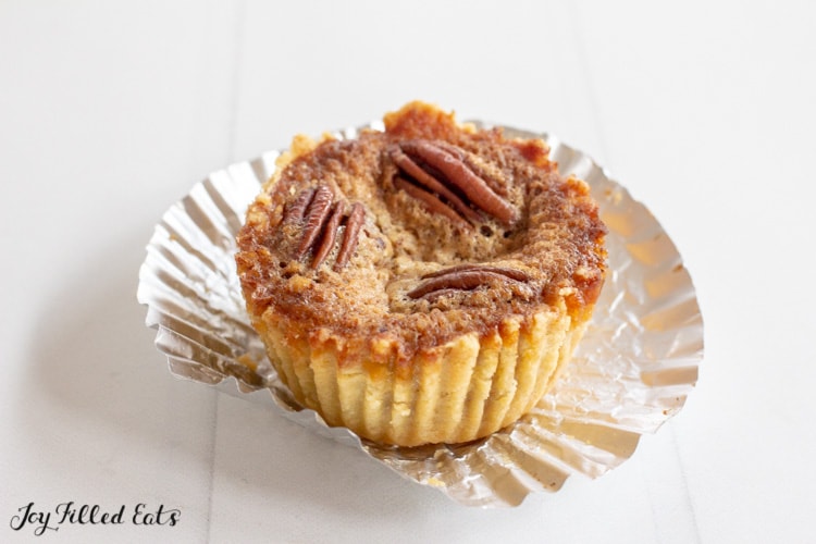 low carb pecan pie tart on an aluminum cupcake wrapper