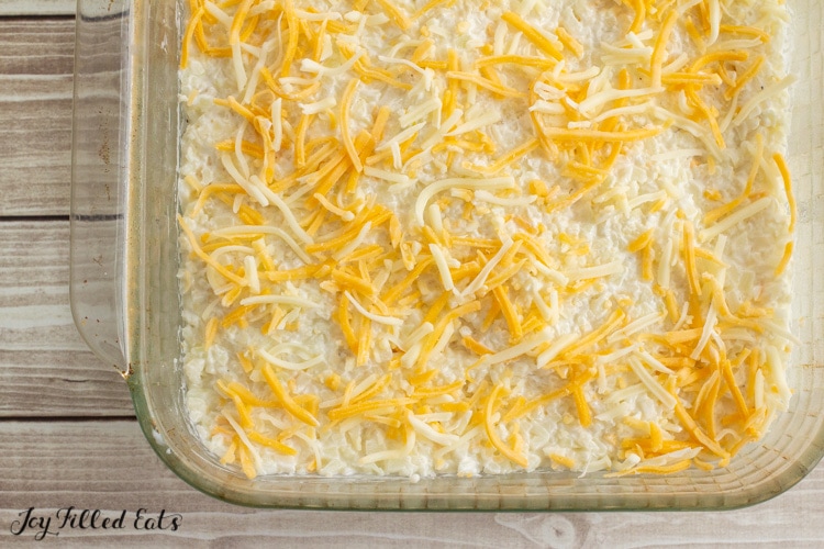 shredded cheese on top of the casserole