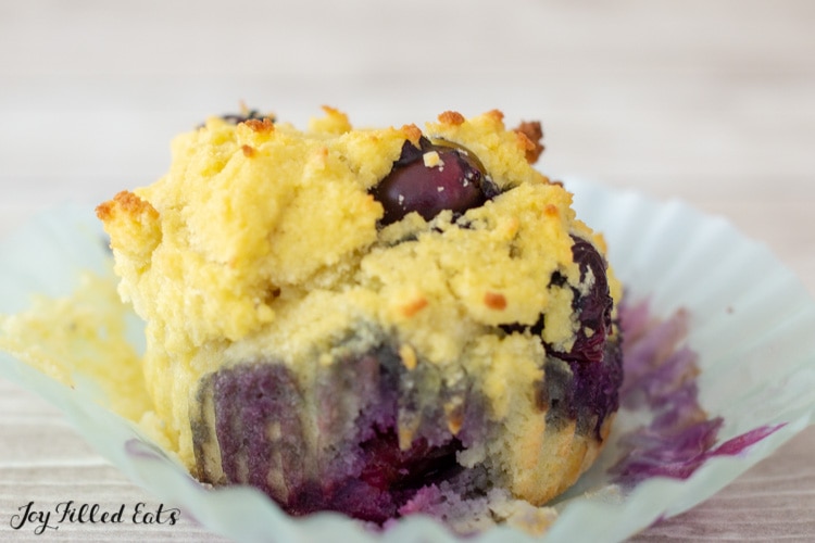coconut flour blueberry muffin on a paper liner