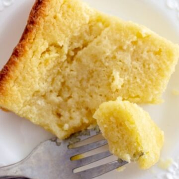 bite of keto butter cake on a fork resting on a plate