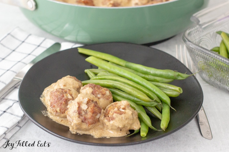 close up of keto swedish meatballs and green beans