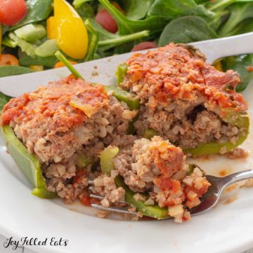 close up of one of the paleo stuffed peppers with a biet on a fork