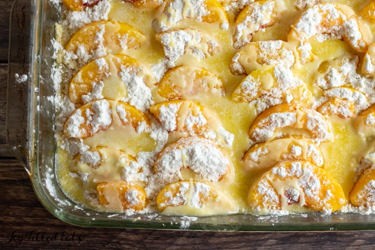 close up of butter and sweetener on top of peaches