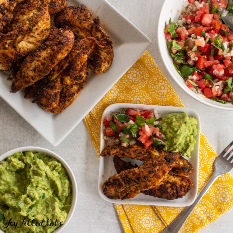 overhead shot of chicken guacamole and salsa