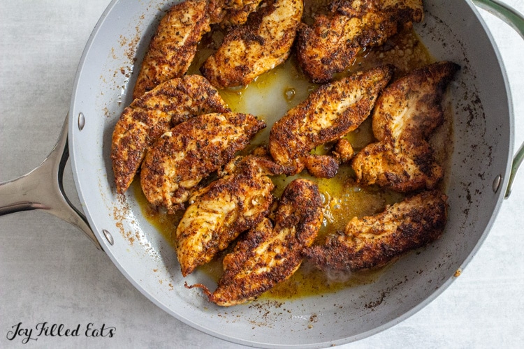 blacked chicken tenders in skillet