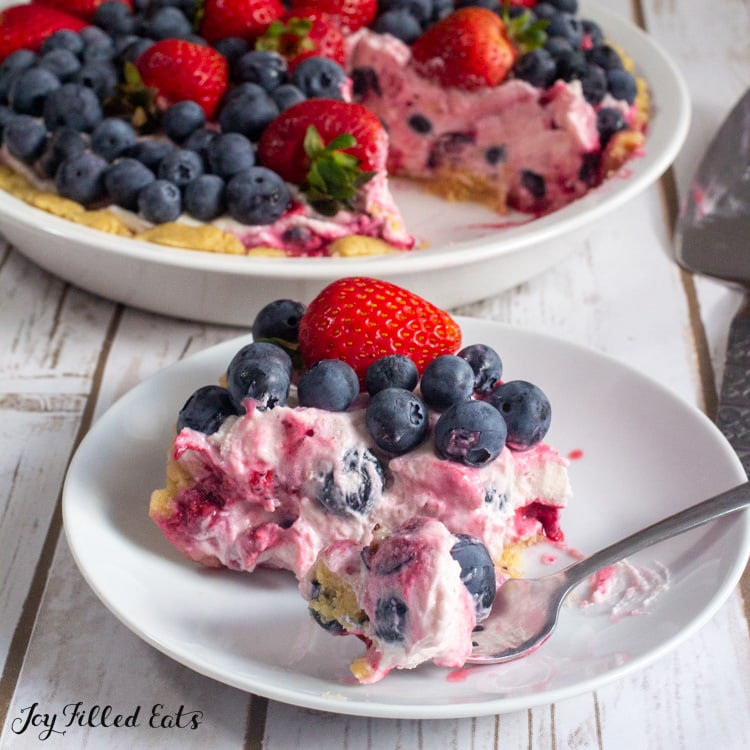 slice of cottage cheese cheesecake topped with berries on a plate