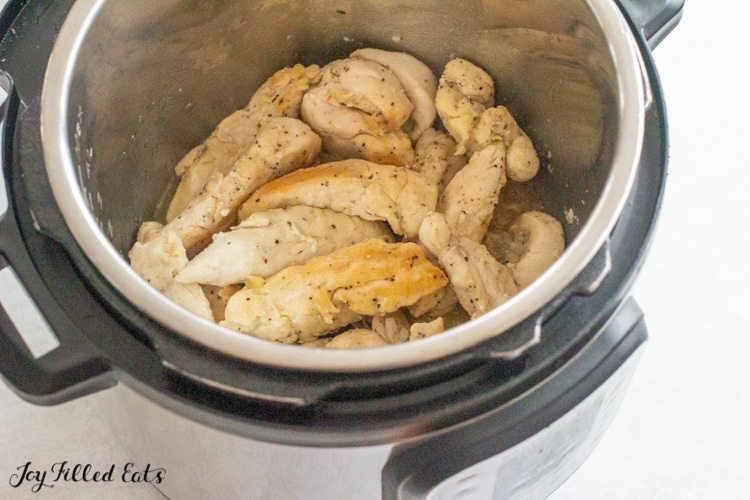 instant pot with cooked chicken