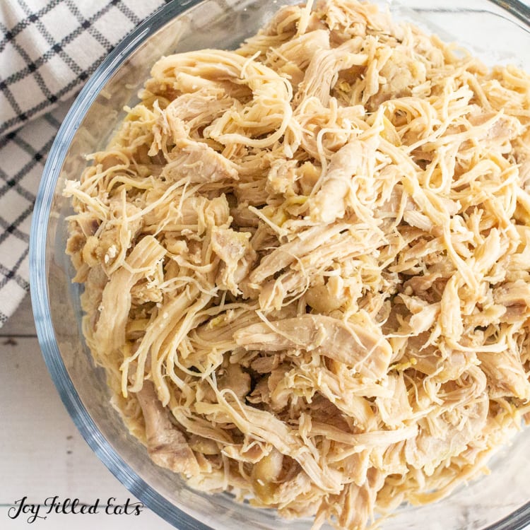 close up of keto pulled chicken in a glass bowl