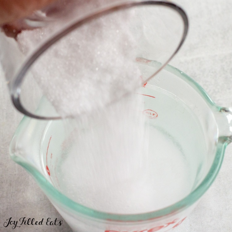 sweetener being poured into water