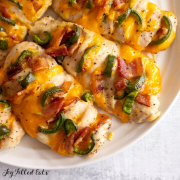 overhead shot of jalapeno popper hasselback chicken on a serving plate