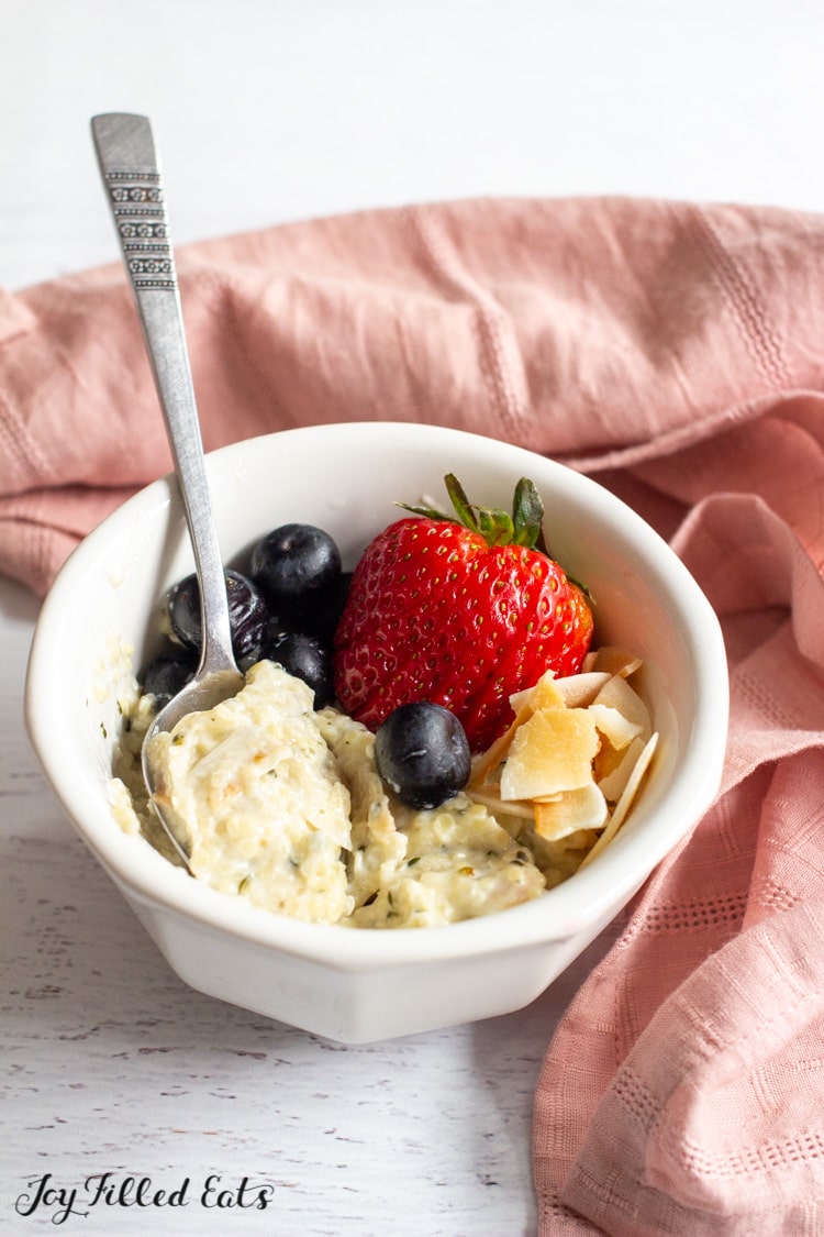 bowl of low carb oatmeal topped with berries