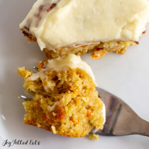 close up with a bite of almond flour carrot cake on a fork