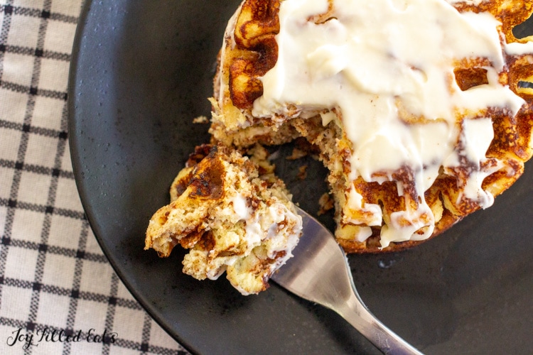 bite of cinnamon roll waffles on a fork