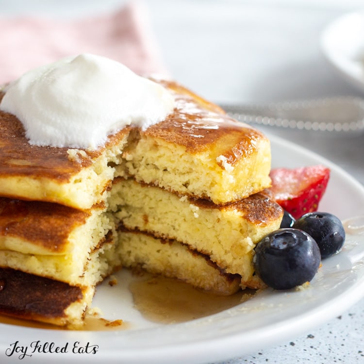stack of three keto buttermilk pancakes with a piece cut out