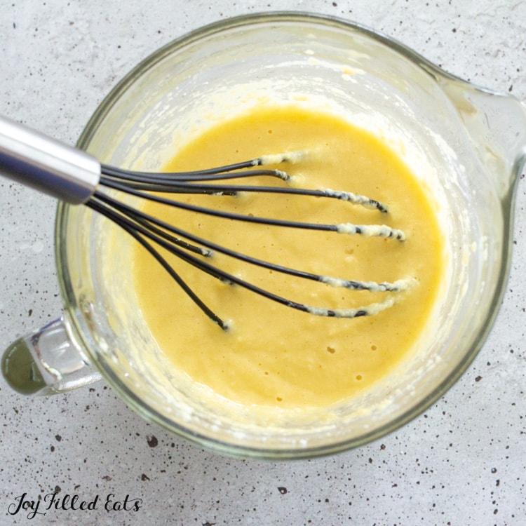 batter in a mixing bowl with a whisk
