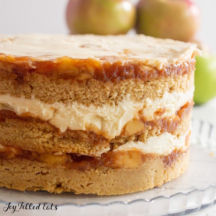 close up of apple cider donut cake on platter showing layers