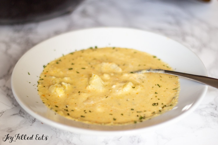 bowl of low carb cauliflower soup with a spoon