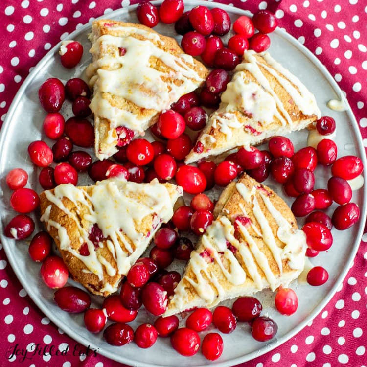 keto scones surrounded with cranberries on tray
