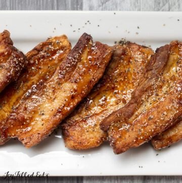 close up of air fried pork belly with sugar free maple syrup, salt, and pepper