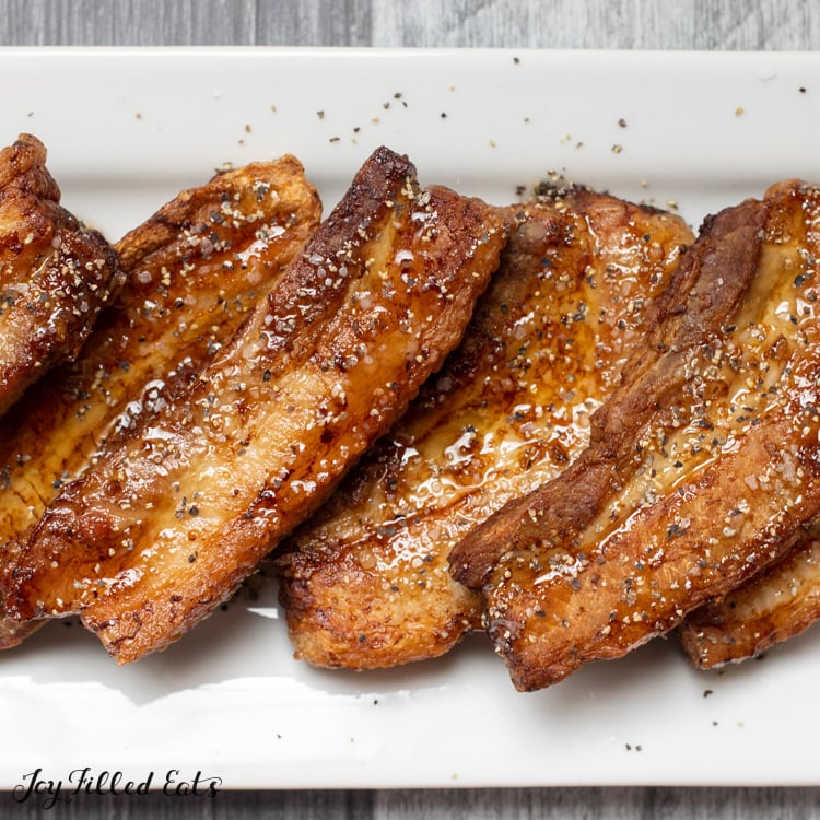close up of air fried pork belly with sugar free maple syrup, salt, and pepper