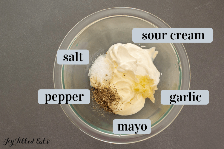 mixing the sour cream, mayo and other ingredients 