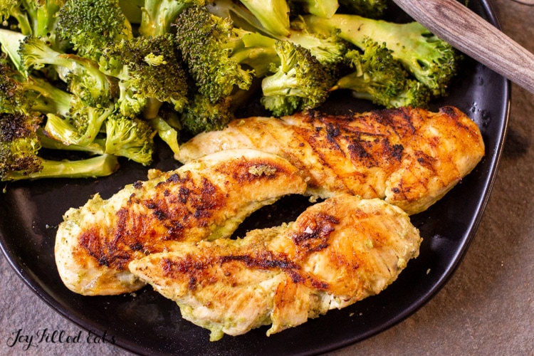 plate full of chicken tenders grilled with mexican chicken marinade with a side of broccoli