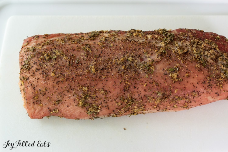 cooked smoked pork loin on cutting board