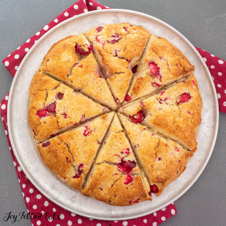 keto scones with cranberries on a baking tray in a circle