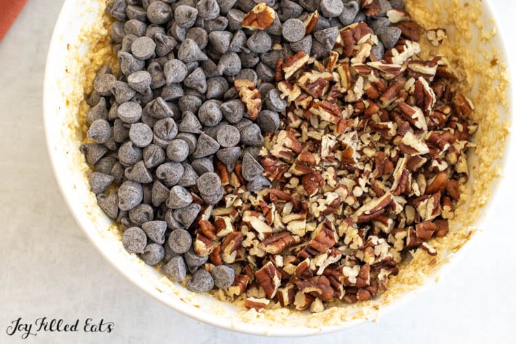 chocolate chips and chopped pecans in bowl of filling