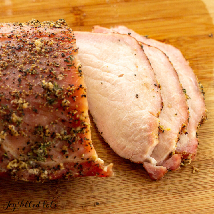 sliced smoked pork loin on cutting board