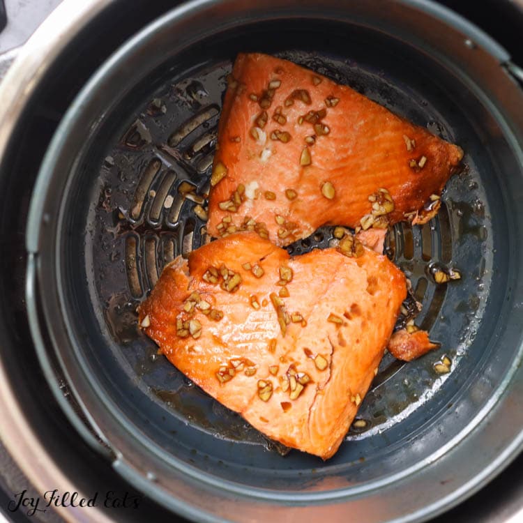 cooked salmon with teriyaki sauce in air fryer close up