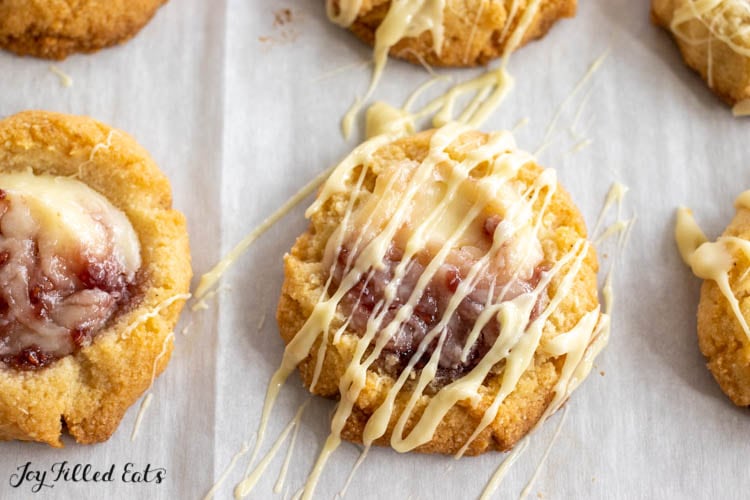 raspberry cheesecake cookies drizzled with white chocolate