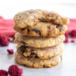 white chocolate and raspberry cookies stacked on top of each other