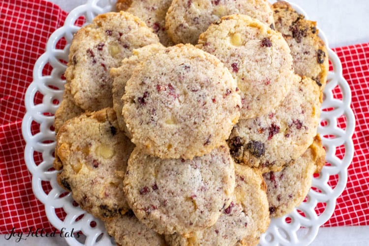 overhead shot of white chocolate and raspberry cookies on a plate