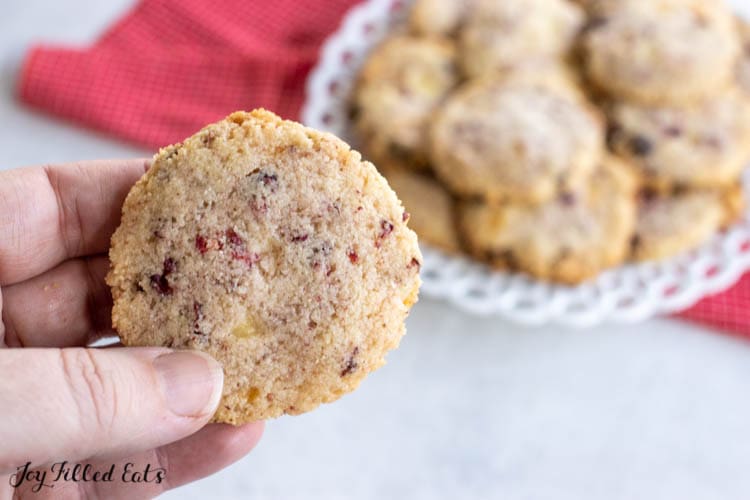 hand holding one of the white chocolate and raspberry cookies