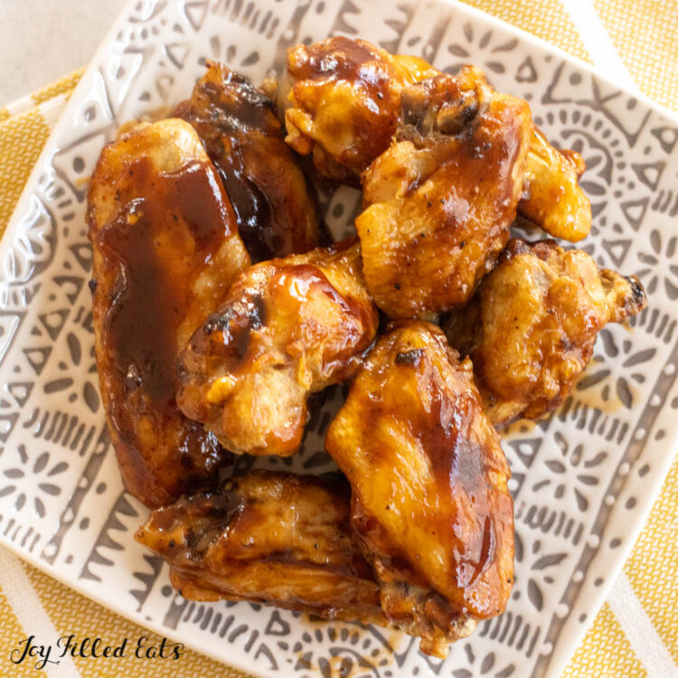 air fryer frozen chicken wings plated with barbecue sauce
