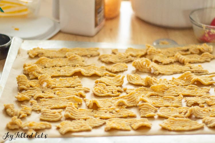 dough strips with ridges on a parchment lined cookie sheet