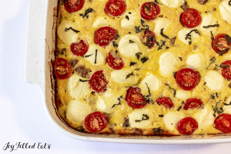 overhead shot of ricotta egg bake with tomatoes and basil