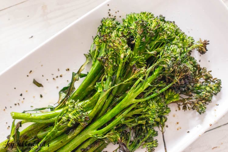 grilled broccolini on a platter