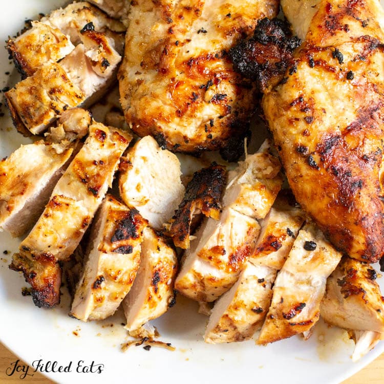 marinated grilled chicken sliced on plate